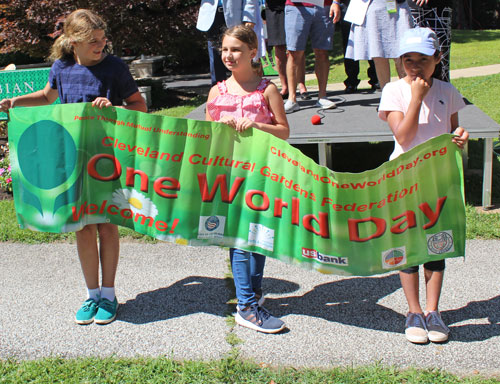 Parade of Flags at 2019 Cleveland One World Day - Cleveland Cultural Gardens banner